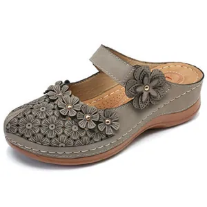 Elegant vintage women's floral hollow-out sandals with retro wedge sole in grey finish