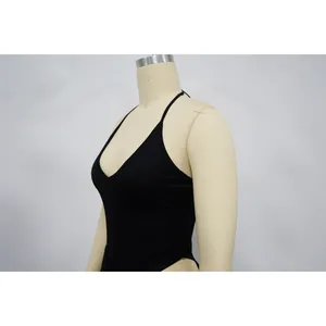 Detailed side view showing the halter neckline of a black bodysuit on a mannequin