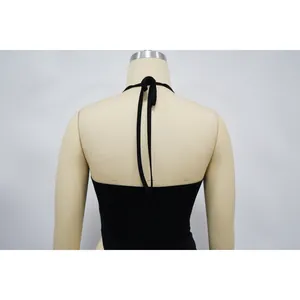 Detailed back view of a black halter neck top with tie closure on a mannequin.