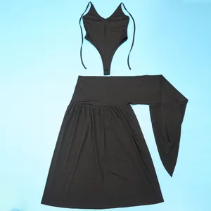 Detailed flat lay of a black two-piece outfit including a bodysuit and tie-waist skirt.