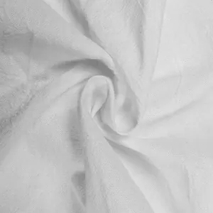 Macro view of white linen fabric texture showing breathable weave details