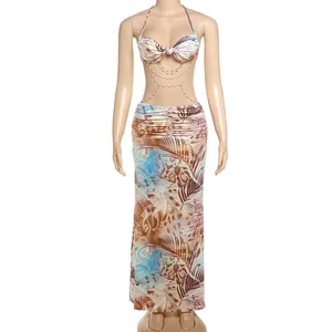 Detail view of a sexy tropical leopard print halter dress with decorative white pearl body chains