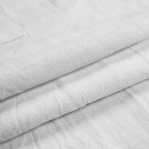 Macro detail showing the breathable white linen fabric texture of these men cargo shorts