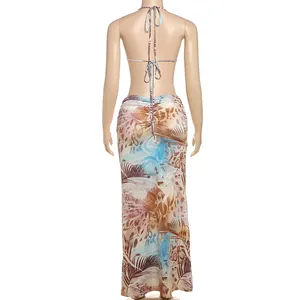 Detailed back view of a sexy halter backless maxi dress with tropical leaf print design