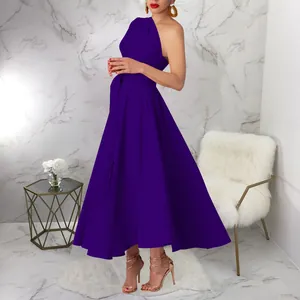Elegant purple one-shoulder sleeveless maxi dress shown on a model in a stylish room