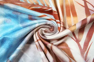 Close-up of the soft fabric texture and tropical palm leaf print on this sexy dress.