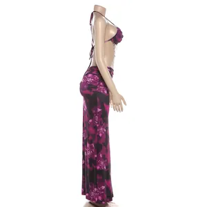 Side view of purple floral halter dress with bead chain detail and backless design