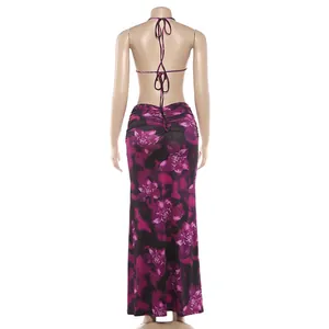 Detailed back view of a halter neck floral maxi dress with elegant ruched details.