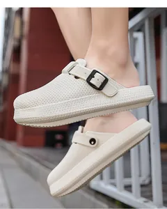 Detailed side view of off-white breathable EVA clogs featuring a stylish black buckle