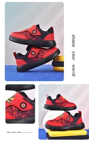 Detail of breathable red and black kids sports shoes with cartoon velcro strap