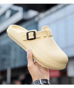 Macro view of cream EVA clog showing breathable non-slip texture and decorative buckle