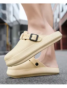 Detail view of breathable beige EVA clogs with textured finish and buckle strap
