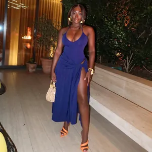 Sexy navy blue halter top and high-slit wrap skirt set perfect for nighttime social events.