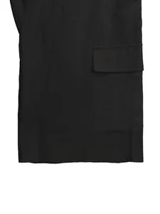 Close-up of side cargo pocket detail and linen fabric texture on black men's shorts
