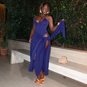 Detailed view of sexy solid purple halter neck bodysuit and high-slit wrap skirt set