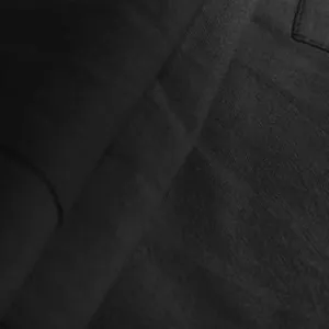 Detailed macro shot showing the breathable black linen fabric texture on men cargo shorts
