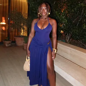 Stylish royal blue sexy high slit wrap maxi skirt set worn by model in garden.