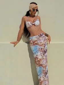 Sexy halter neck dress set with elegant bead chain detail and vibrant tropical print