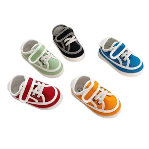 Toddler canvas sneakers with soft soles and white velcro straps in five vibrant colors