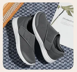 Lightweight grey mesh walking shoes for elderly with comfortable adjustable strap