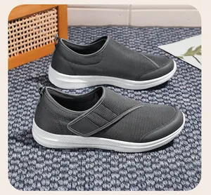 Detailed macro view of grey mesh breathable walking shoes for elderly parents