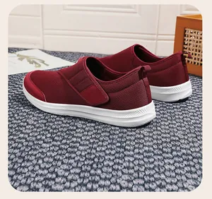 Detailed view of maroon breathable mesh walking shoes for seniors with thick soles