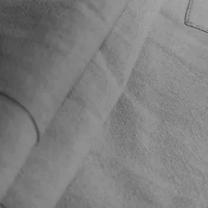 Macro detail of breathable linen fabric texture on men's drawstring cargo shorts.