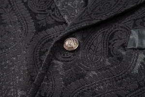 Close-up of black paisley patterned men's suit vest with vintage metallic button