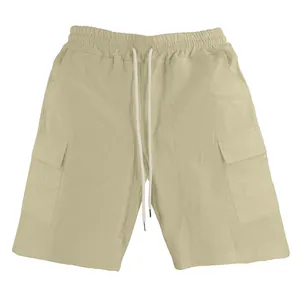 Detail view of men's beige linen cargo shorts with drawstring and side pockets.