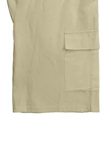 Close-up of side pocket and breathable linen fabric on men's cargo shorts