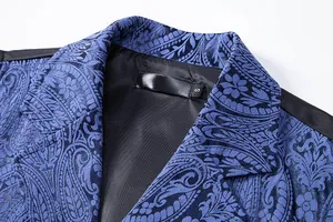 Close-up of blue paisley suit vest notch lapel showing premium jacquard fabric texture