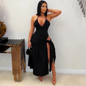 Sexy black two-piece set featuring a halter neck top and high-slit maxi skirt