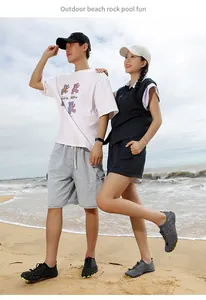 Breathable quick-dry wading shoes for men and women worn by models on a sunny beach