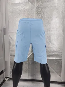 Back view of light blue linen cargo shorts for men with a loose fit and side pockets.