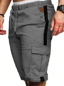Detailed macro view of gray men's cargo shorts featuring black side stripe and pocket