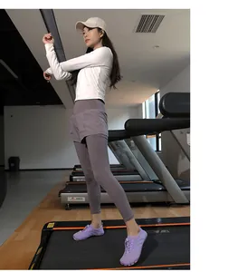 Breathable purple water shoes worn by a model on a treadmill in a gym setting