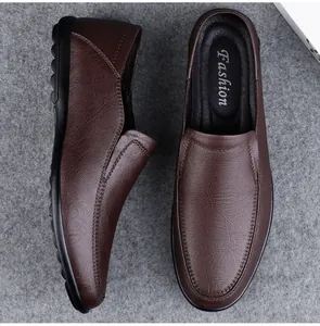 Detailed top and side view of brown soft leather men's slip-on loafers with textured finish