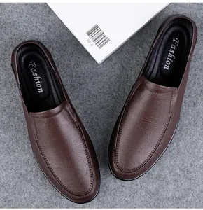 Detail view of men's dark brown leather loafers with soft grain texture and slip-on style.