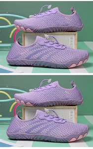 Detailed side view of purple breathable mesh aqua shoes for outdoor water sports and beach