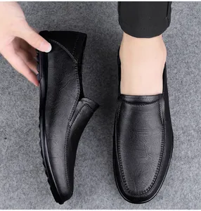 Close-up of black soft leather men's slip-on loafers showing texture and stitching