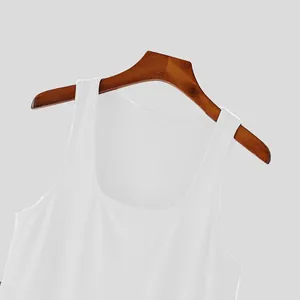 Close-up of the ribbed fabric and round neckline of this white athletic mens tank top.