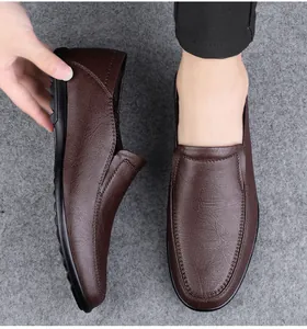 Detailed view of brown men's slip-on loafers highlighting soft leather texture