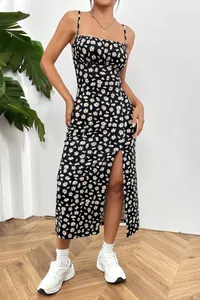 Close-up of summer floral midi dress with spaghetti straps and a sexy side slit