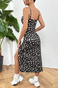 Back view of a sexy black daisy print summer dress with adjustable spaghetti straps