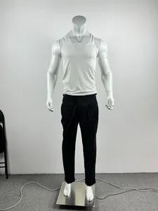 Full view of men's white ribbed slim fit athletic tank top and black pants on a mannequin