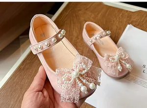 Detailed view of pink princess shoes for girls featuring sweet lace bows and pearls