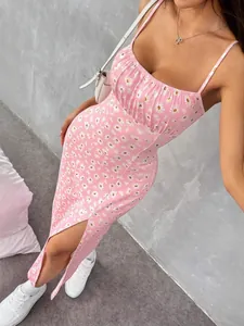 Elegant pink daisy print camisole dress with adjustable straps and sexy side slit.