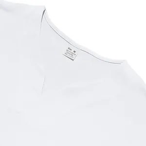 Macro view of white V-neck jersey neckline showing quick-dry fabric and size tag