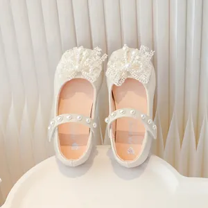Sweet cream girls' princess shoes with lace bows and pearl straps on white background