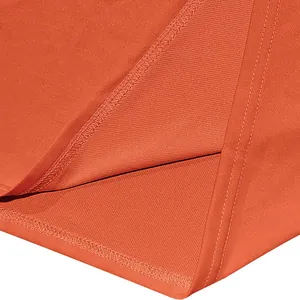 Close-up of premium orange quick-dry fabric with double-stitched hem on a men's polo shirt